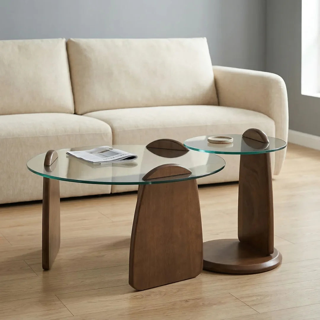 Two glass coffee tables with wooden bases in a living room setting.