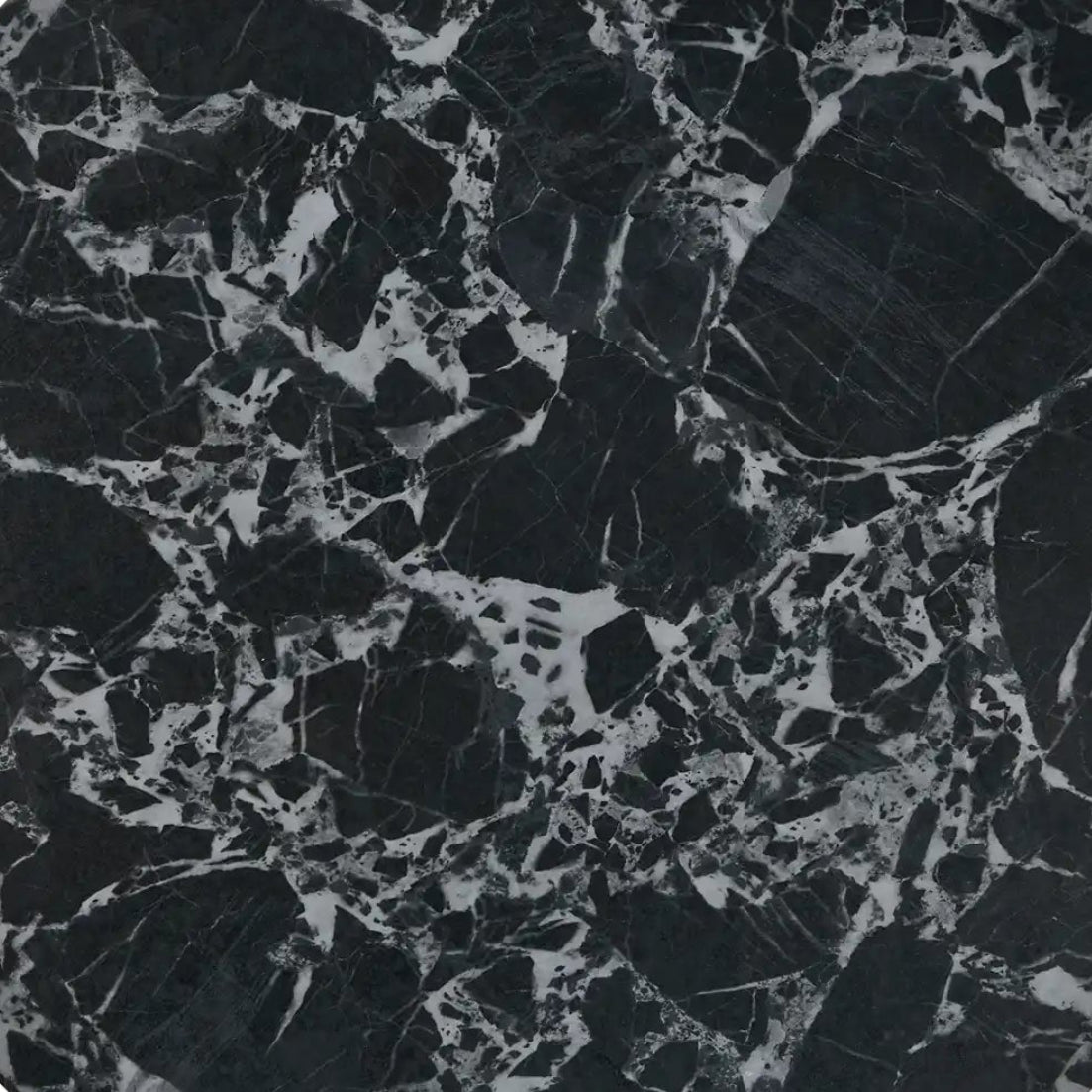 Round black marble coaster with a white background