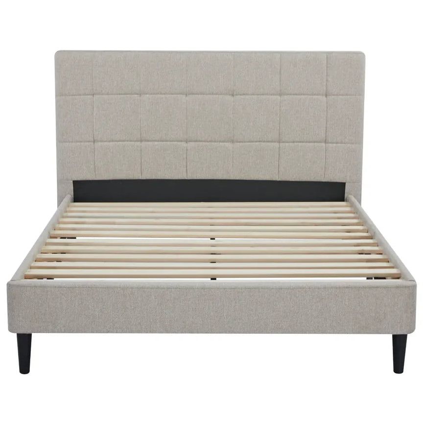Beige upholstered bed with wooden slats on a white background