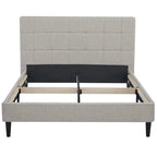 Gray upholstered bed frame on a white background