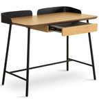 Wooden desk with black metal legs and top on a white background
