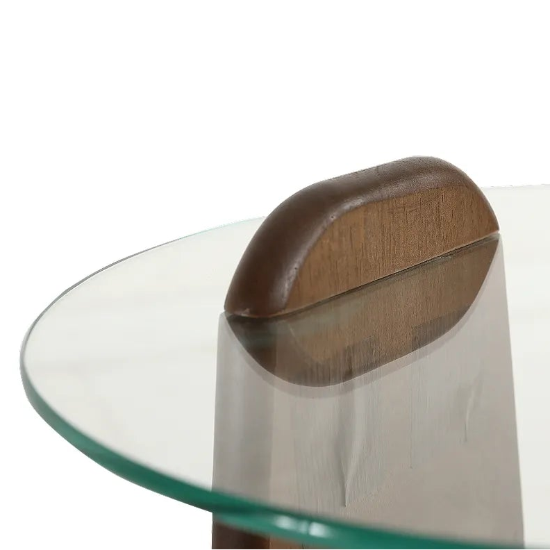Glass table with a wooden leg on a white background
